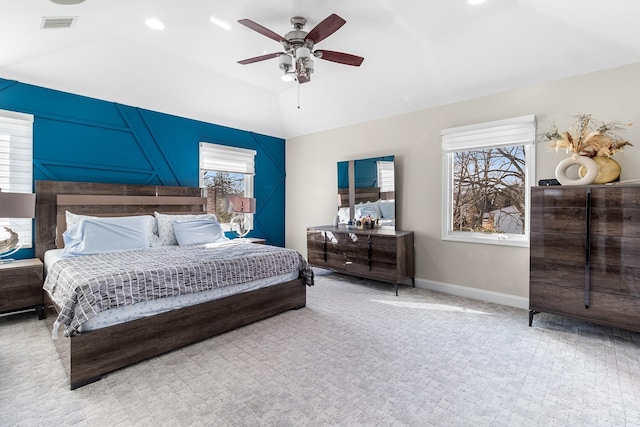 bedroom with lofted ceiling, visible vents, ceiling fan, and baseboards