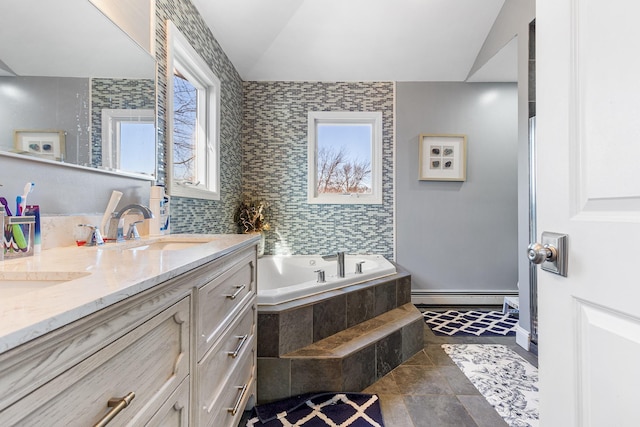 full bathroom with a garden tub, double vanity, a baseboard radiator, lofted ceiling, and a sink