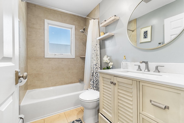 bathroom with visible vents, toilet, shower / tub combo, vanity, and tile patterned floors