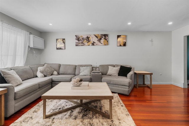 living room with dark wood-style floors, recessed lighting, and baseboards