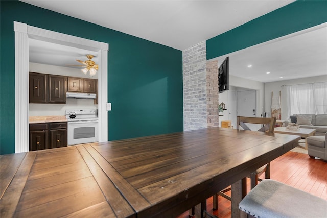 dining area featuring wood finished floors, recessed lighting, and a ceiling fan