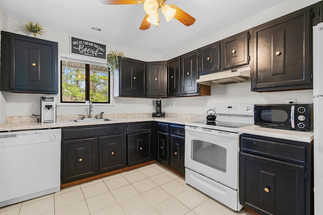 kitchen with under cabinet range hood, a sink, white appliances, light countertops, and ceiling fan