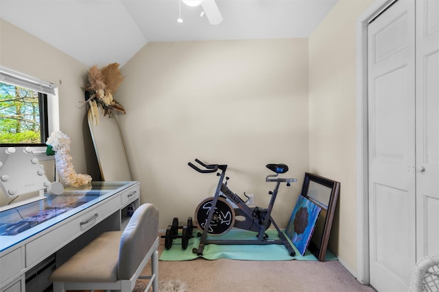 exercise room with lofted ceiling, carpet flooring, and a ceiling fan