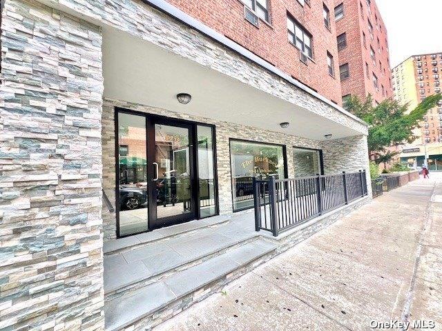 entrance to property with brick siding