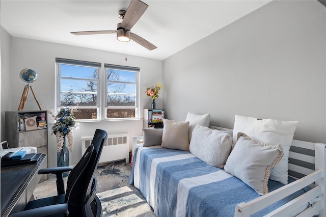 carpeted office with a ceiling fan and radiator