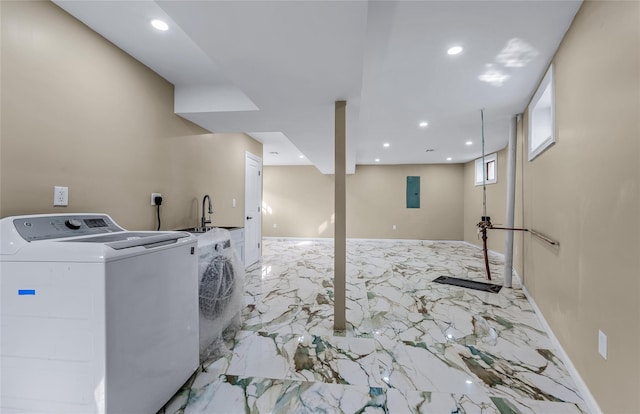 laundry area featuring marble finish floor, recessed lighting, a sink, washer / dryer, and baseboards