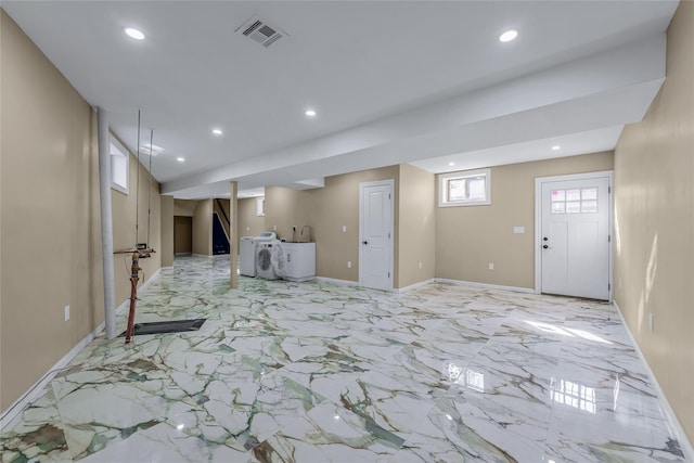 unfurnished living room featuring recessed lighting, visible vents, and independent washer and dryer