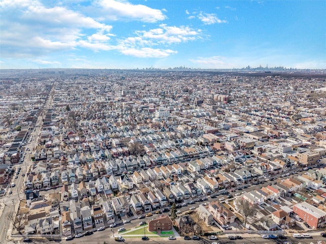 birds eye view of property with a residential view