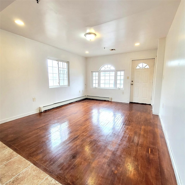 interior space featuring dark wood-style floors and baseboards