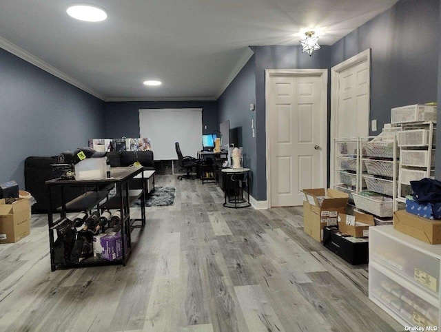 office area featuring crown molding, baseboards, and wood finished floors