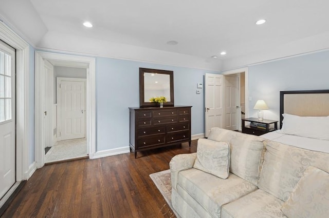 bedroom with recessed lighting, baseboards, and wood finished floors