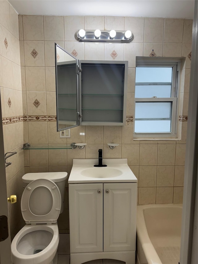 full bathroom with toilet, a washtub, vanity, tile walls, and decorative backsplash