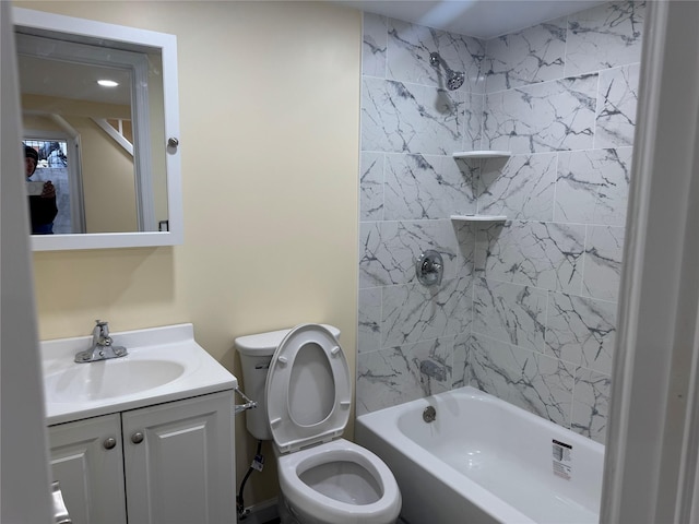 bathroom featuring shower / bath combination, vanity, and toilet