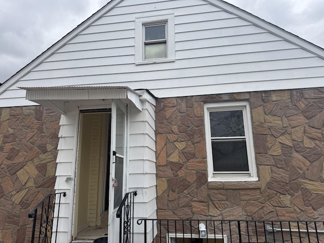 exterior space featuring stone siding