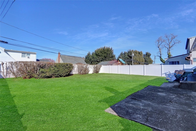 view of yard with a fenced backyard and a patio