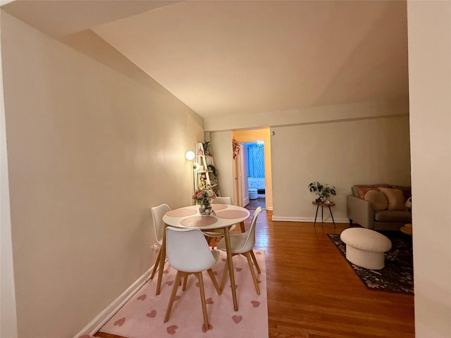 dining room with wood finished floors and baseboards