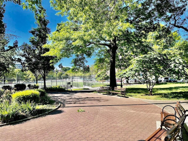 view of property's community with fence