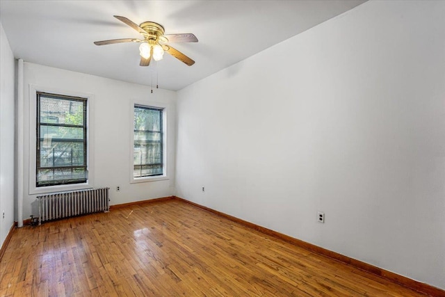32-05 81st St Unit A3, Jackson Heights, NY 11370 - empty room featuring radiator, hardwood / wood-style floors, baseboards, and ceiling fan