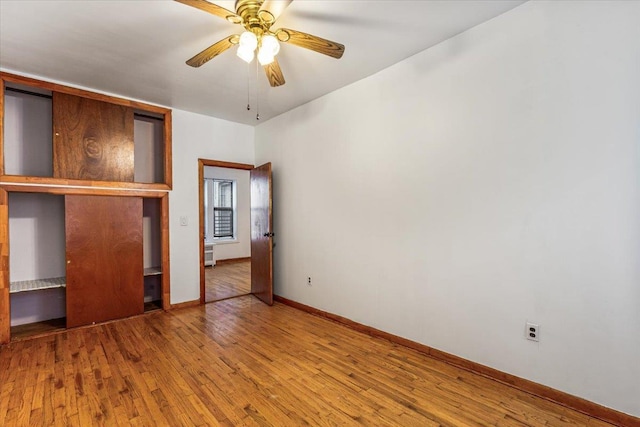 32-05 81st St Unit A3, Jackson Heights, NY 11370 - unfurnished bedroom featuring wood finished floors, baseboards, and ceiling fan