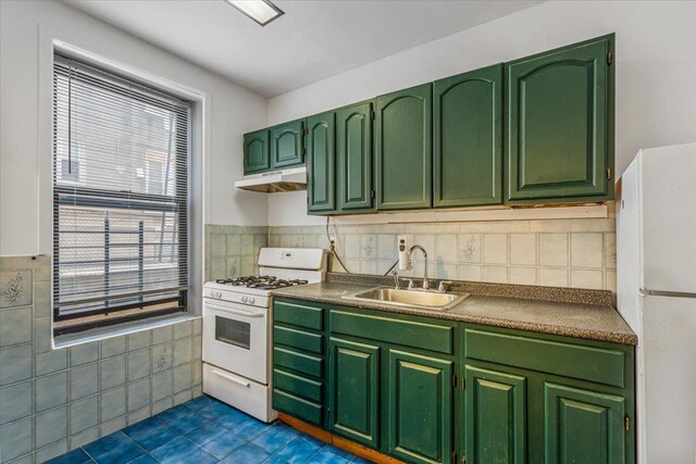 32-05 81st St Unit A3, Jackson Heights, NY 11370 - kitchen with white appliances, a sink, green cabinets, under cabinet range hood, and dark tile patterned floors