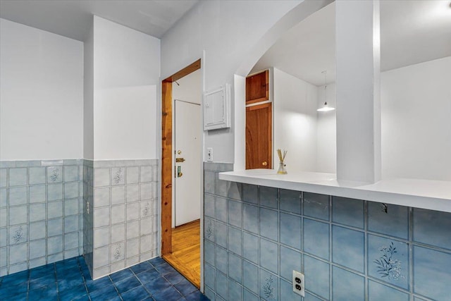 32-05 81st St Unit A3, Jackson Heights, NY 11370 - bathroom featuring tile walls, wainscoting, and tile patterned flooring