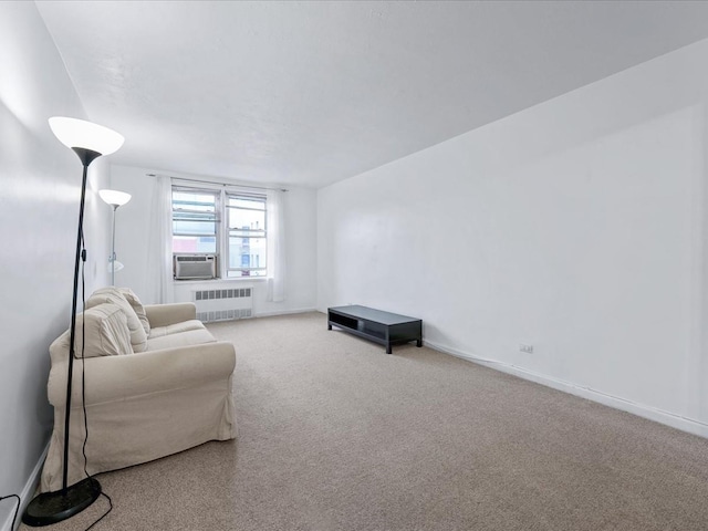 living room with baseboards, carpet, cooling unit, and radiator