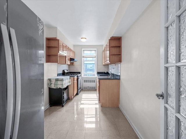 kitchen featuring tasteful backsplash, open shelves, appliances with stainless steel finishes, and baseboards