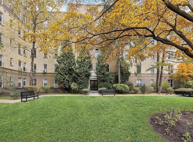 view of home's community with a lawn