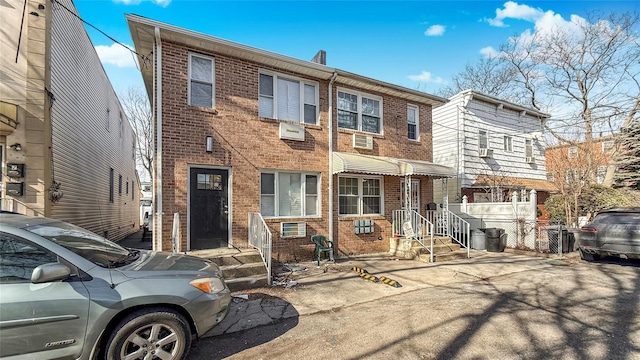 view of property featuring brick siding