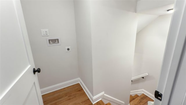 washroom with laundry area, light wood-style flooring, hookup for a washing machine, and electric dryer hookup