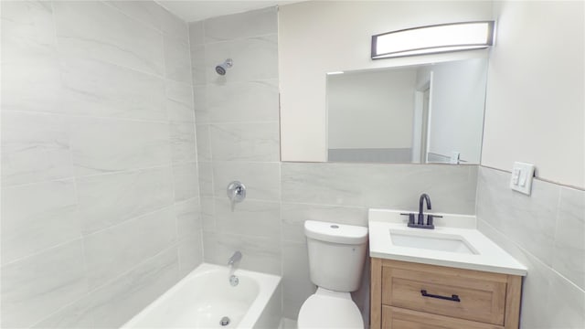 full bath featuring tile walls, tasteful backsplash, toilet, vanity, and  shower combination