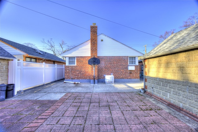 view of patio / terrace featuring fence