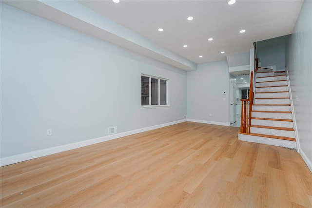 interior space with light wood finished floors, baseboards, visible vents, stairs, and recessed lighting