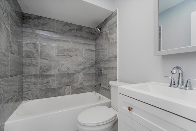 bathroom featuring bathing tub / shower combination, toilet, and vanity