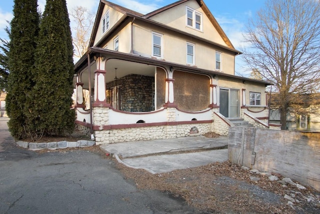 view of front of house featuring stucco siding