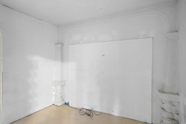 unfurnished room featuring concrete floors