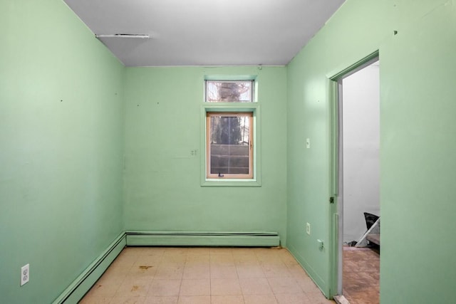 unfurnished room featuring light floors, a baseboard radiator, and baseboard heating