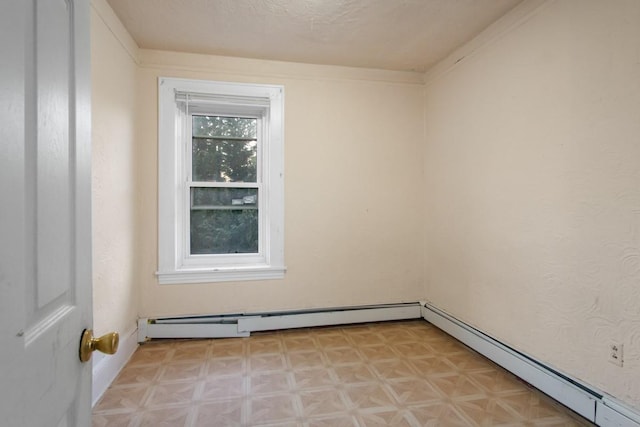 unfurnished room with light floors and baseboard heating