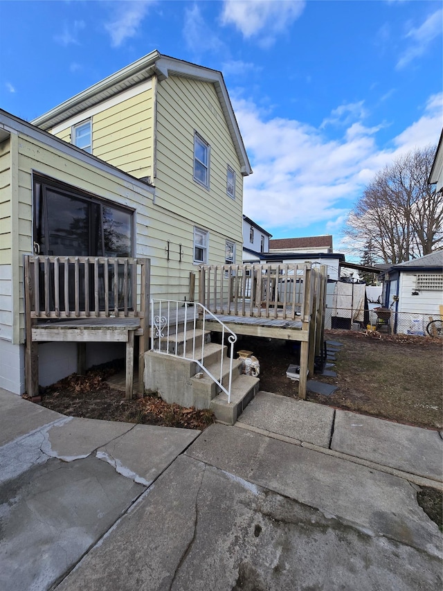 view of side of property with a deck