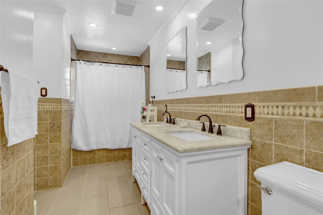 full bathroom with a shower with curtain, a sink, tile walls, and toilet