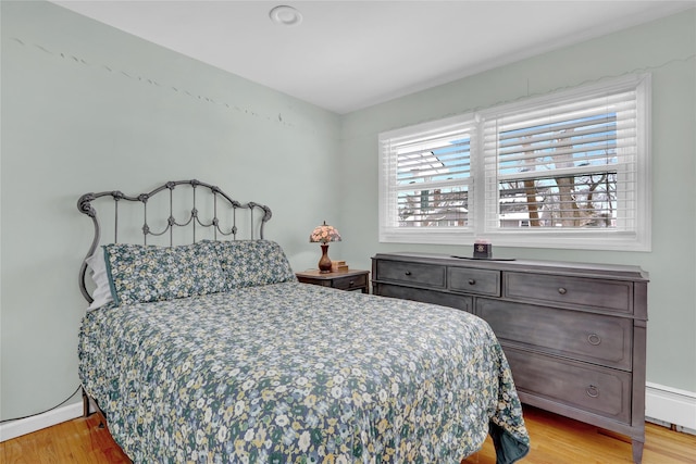 bedroom with light wood finished floors