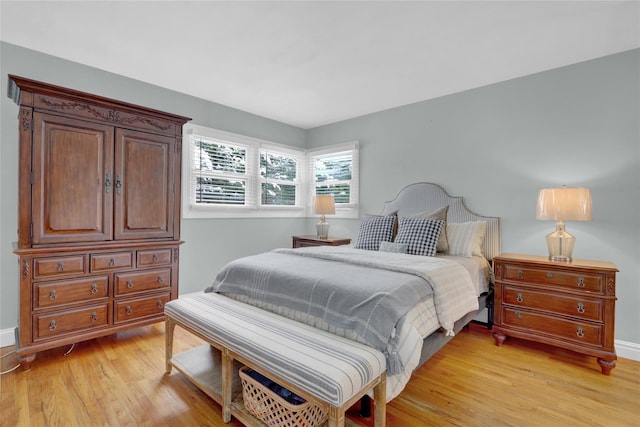 bedroom with light wood finished floors