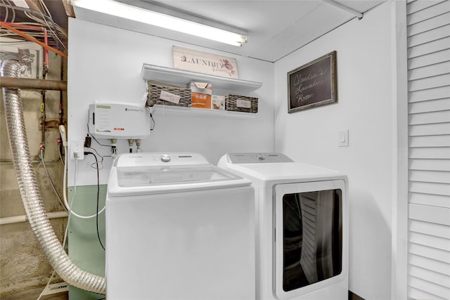 clothes washing area with laundry area and separate washer and dryer