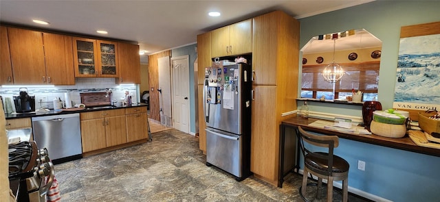 kitchen with stainless steel appliances, dark countertops, backsplash, glass insert cabinets, and a sink