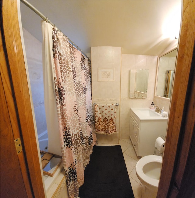 bathroom with a shower with curtain, tile walls, vanity, and tile patterned floors