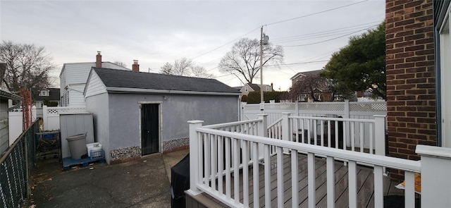 exterior space featuring an outbuilding, a patio, and a fenced backyard