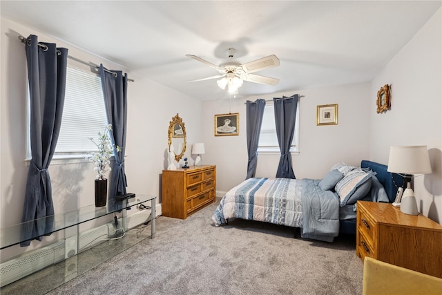 bedroom featuring carpet floors, multiple windows, and a ceiling fan