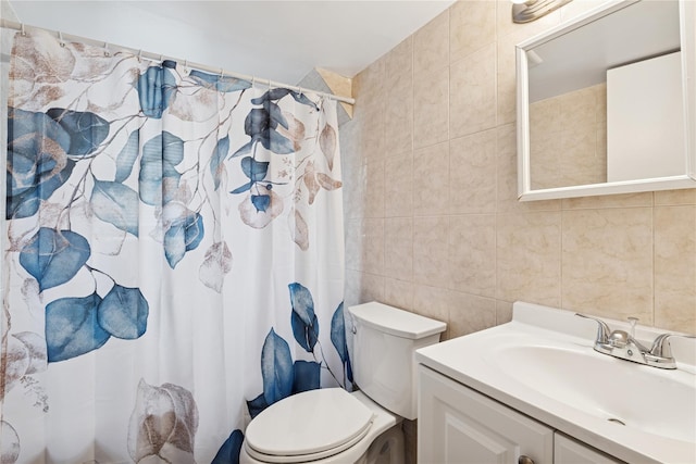 bathroom with toilet, vanity, tile walls, and a shower with curtain