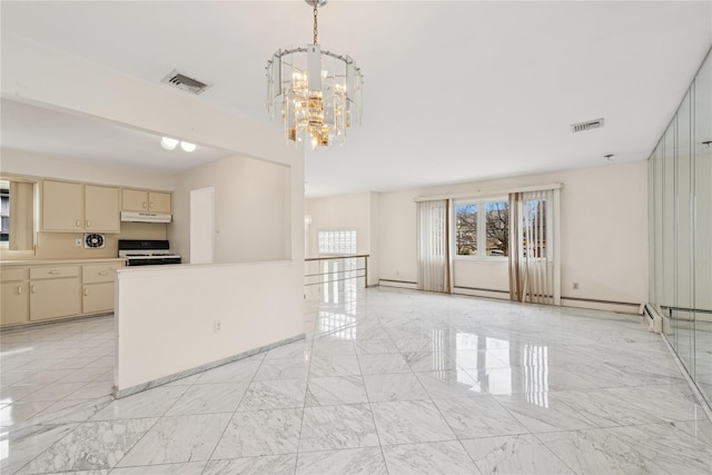 interior space featuring cream cabinetry, under cabinet range hood, marble finish floor, and gas range gas stove