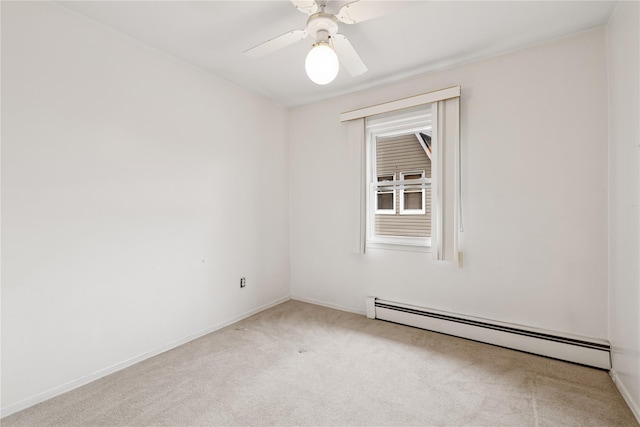 carpeted empty room with a ceiling fan, a baseboard radiator, and baseboards